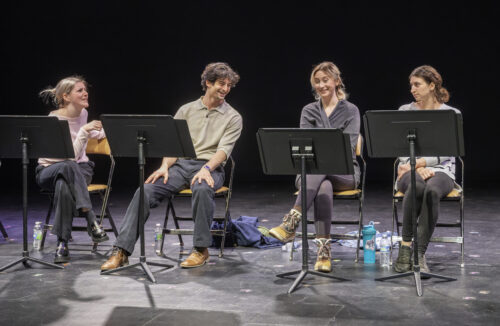 4 actors on stage with music stands