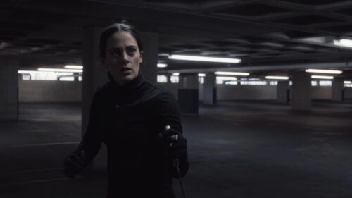 person holding sword in a film shot