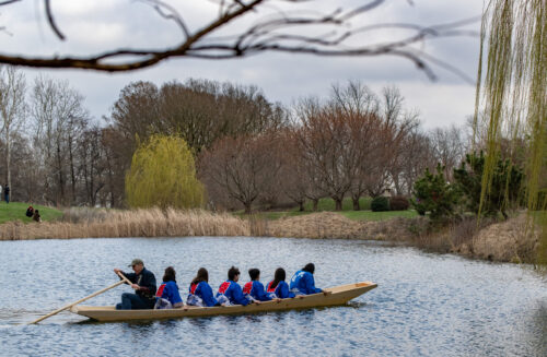 Students and Douglas Brooks testing out the boat they built