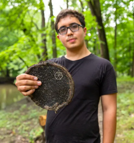 Gabe Tavas holding a piece of Pyrus™, the sustainable wood alternative.