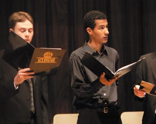 Hillman singing in the University of Illinois Concert Choir during commencement.