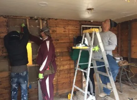 People working on remodels of a house