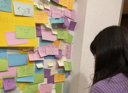 Girl looking at sticky notes
