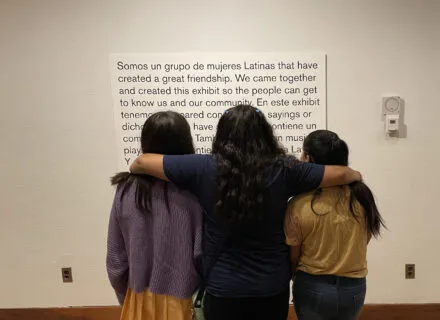 Three girls reflecting on the exhibit.