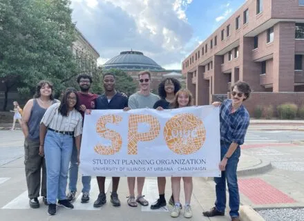 students holding up a sign