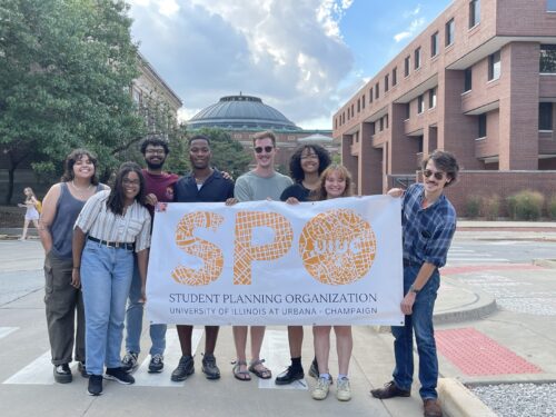 students holding up a sign