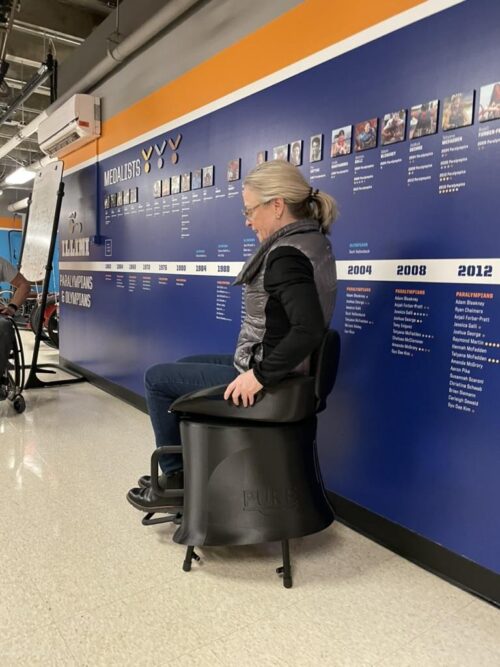 person sits in chair