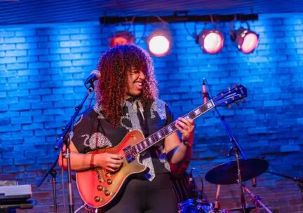 woman playing guitar