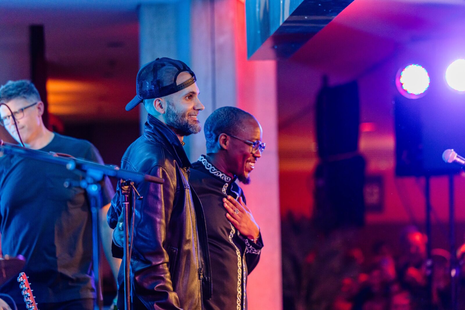 Two men looking at audience from stage