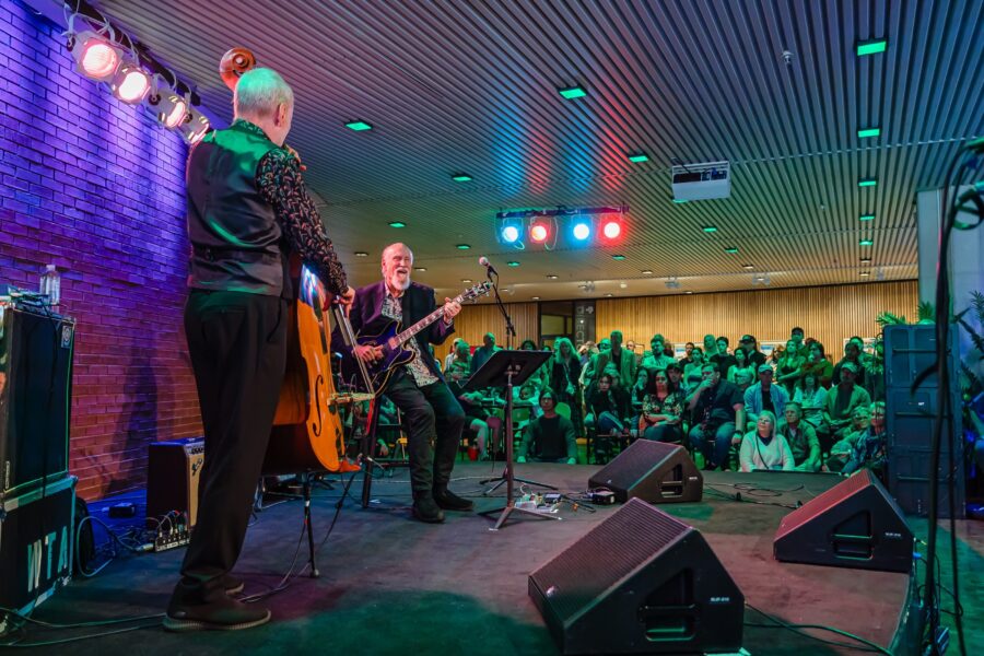 Two men playing music on stage