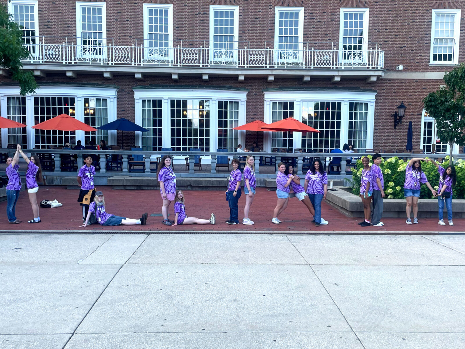 people gathered in a line spelling out the word "ILLINI" with their bodies