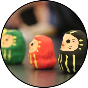 three paper maches dolls
