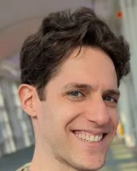 smiling man with brown hair