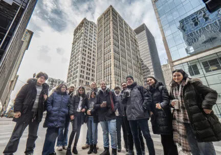 many people gathered in Chicago outside several skyscrapers