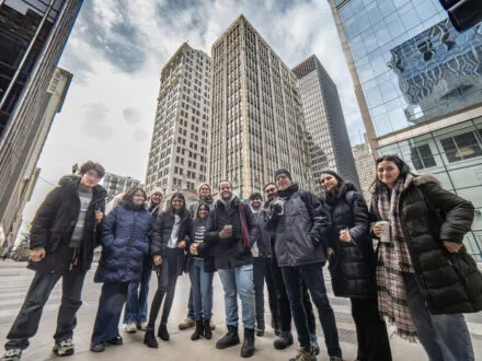 many people gathered in Chicago outside several skyscrapers