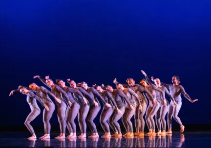dancers in purple leotards in a line